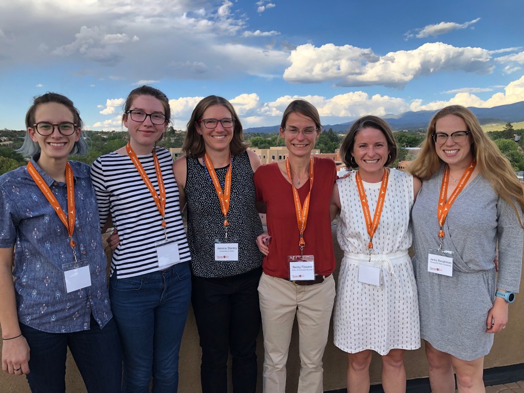 6 superb geologists with Santa Fe at sunset in the background