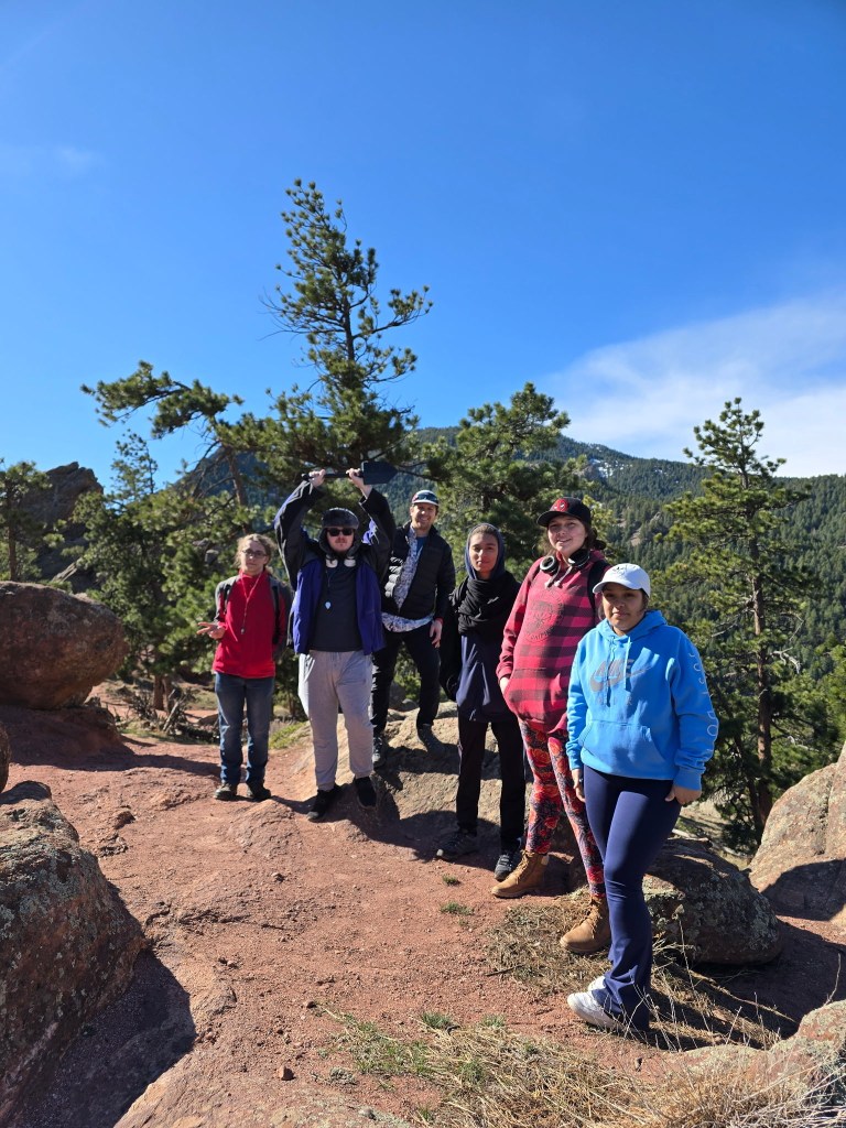 6 geologists on a sandstone outcrop outside of Boulder, CO